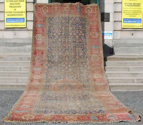 A Persian long rug, Ziegler, 19th century, the blue rectangu...