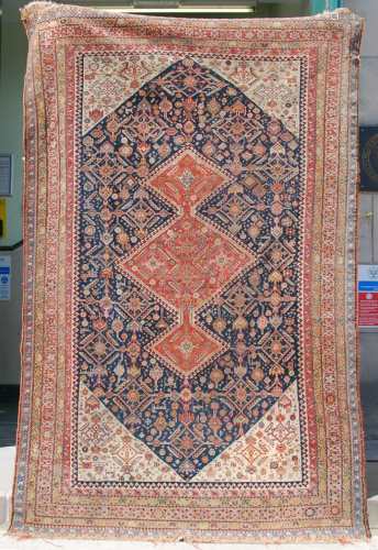 A Persian rug, late 19th/ early 20th century, the rectangula...