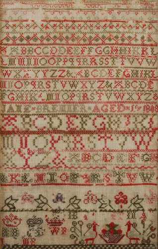 A 19th century needlework sampler, worked in red and green c...