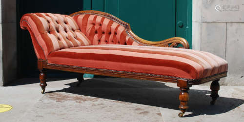 A Victorian mahogany chaise longue, with button down back an...
