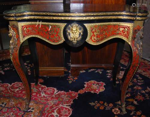 A 19th Century Boulle style games table, the hinged serpenti...