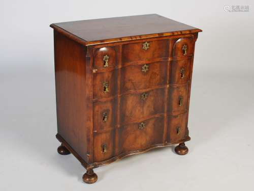 An early 20th century walnut chest of drawers in the Queen A...