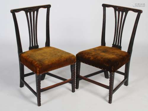 A pair of George III mahogany chip-carved side chairs, the f...