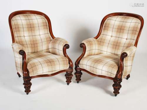 A pair of 19th century mahogany armchairs, the button down u...