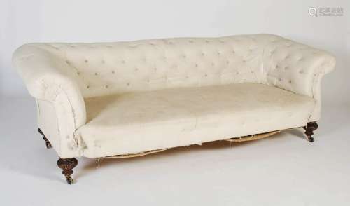 A 19th century Chesterfield sofa, the white upholstered butt...