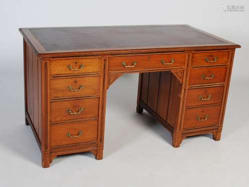 A 19th century Aesthetic Movement walnut pedestal desk, the ...