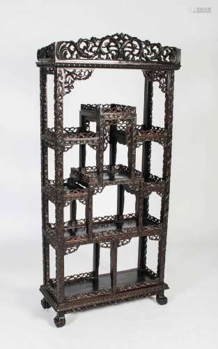 A Chinese dark wood display cabinet, Qing Dynasty, with scro...