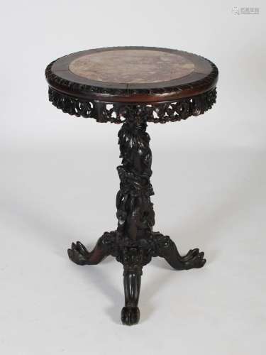 A Chinese dark wood occasional table, Qing Dynasty, the circ...