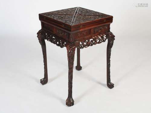 A Chinese dark wood envelope games table, late Qing Dynasty,...