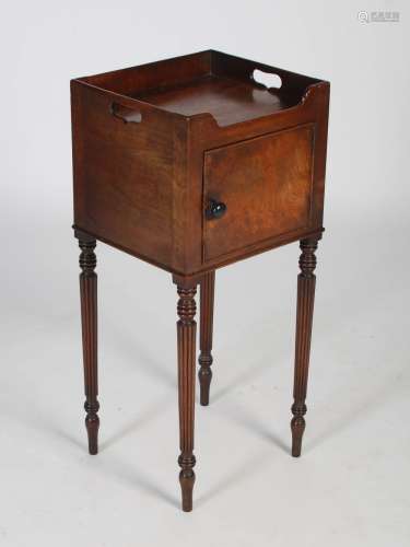 An early 19th century mahogany bedside locker/ pot cupboard,...