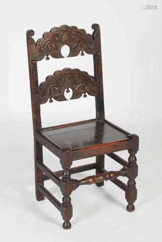 A 17th century Derbyshire joined oak side chair, with invert...