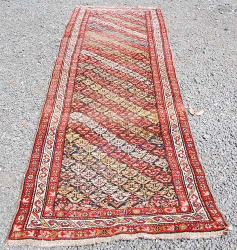 A Persian runner, late 19th century, the earth brown coloure...