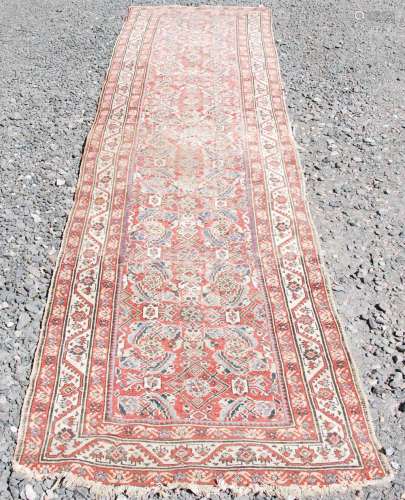 A Persian long rug and a Persian runner, the long rug with a...