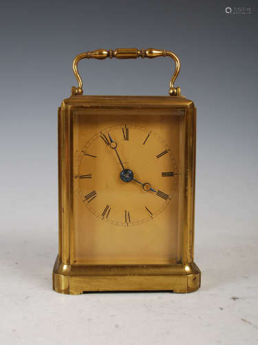 A 19th century lacquered brass carriage clock, with Roman nu...