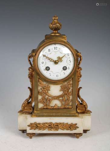 A late 19th century French gilt metal and white marble mante...