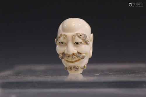 Japanese carved bead of a monk head