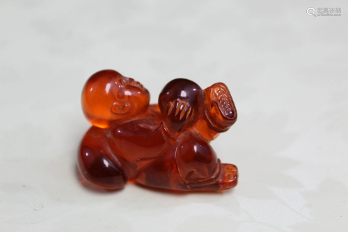 Chinese Carved Amber Toggle of a Boy