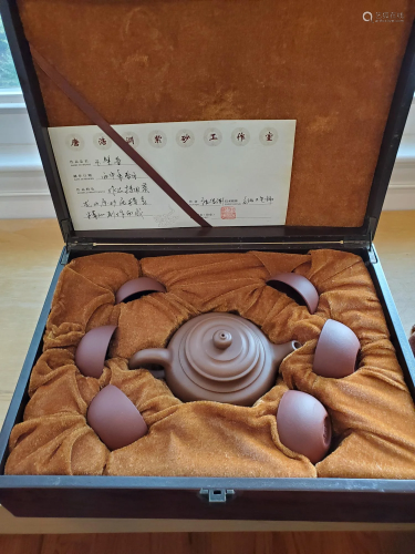 Set of Chinese Yixing teapot and tea cups.