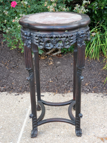 Chinese caved wood stand with marble top.