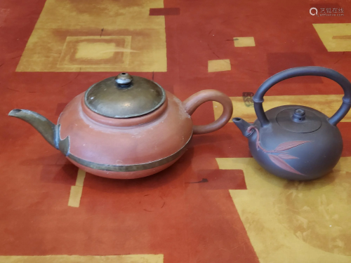 Two Chinese Yixing teapots.