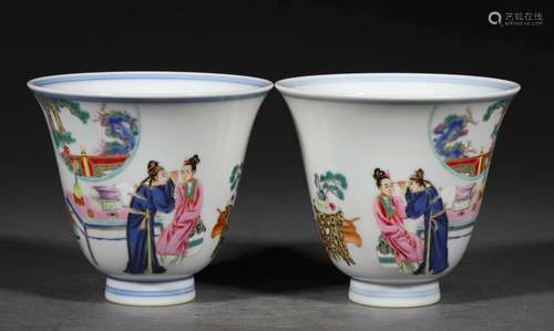 A PAIR OF QING DYNASTY FAMILLE ROSE FIGURE CUPS