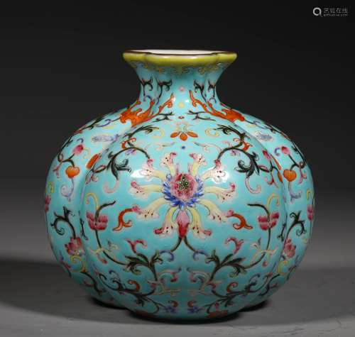 A QING DYNASTY FAMILLE ROSE FLOWER ZUN