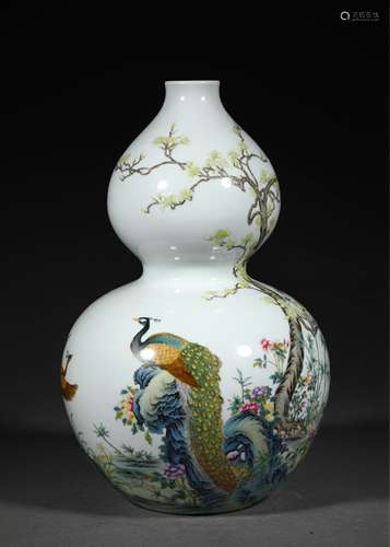 A QING DYNASTY FAMILLE ROSE PEACOCK GOURD BOTTLE