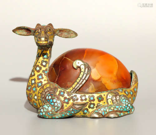 A bronze paperweight ware with gold and silver