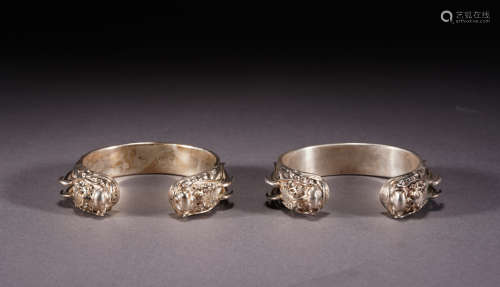 A pair of silver bracelet