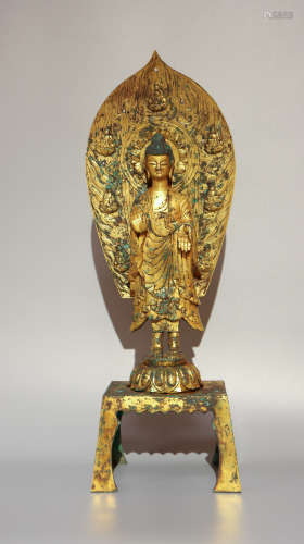 A gilt-bronze statue of buddha