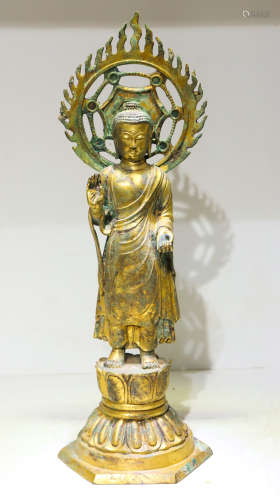 A gilt-bronze statue of Shakya Muni