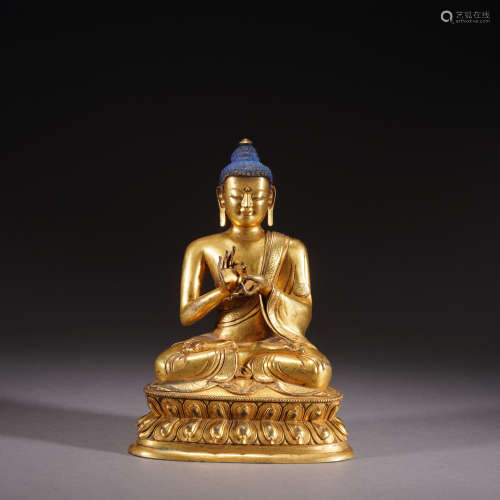 A gilt-bronze statue of Shakya Muni