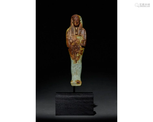 EGYPTIAN FAIENCE SHABTI WITH REDDISH-BROWN AREAS -