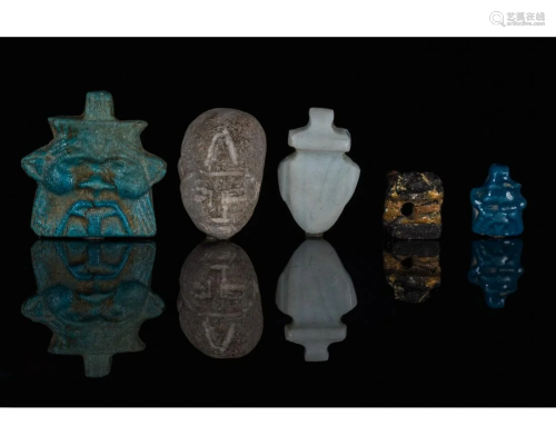 EGYPTIAN GROUP OF AMULETS AND A HEAD OF PTAH