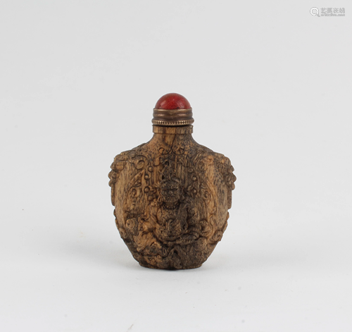 A Carved Wooden Snuff Bottle