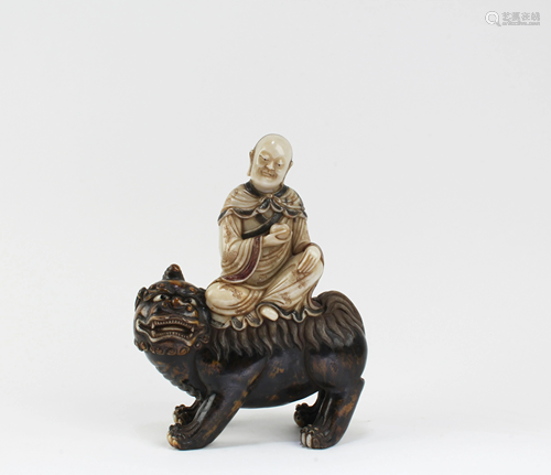 A Carved Soapstone Figurine