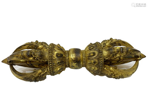 A GILT-BRONZE VAJRA.