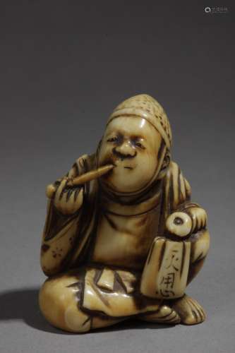 A 19th century Japanese netsuke. Signed Tomomasa