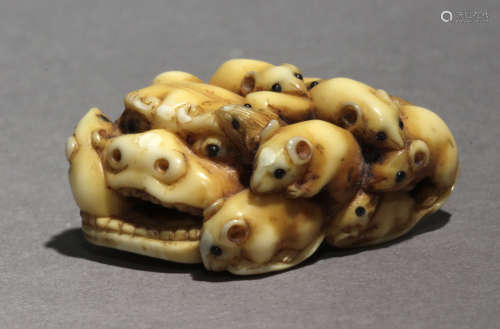 A mid 19th century Japanese netsuke from Edo period. Signed ...
