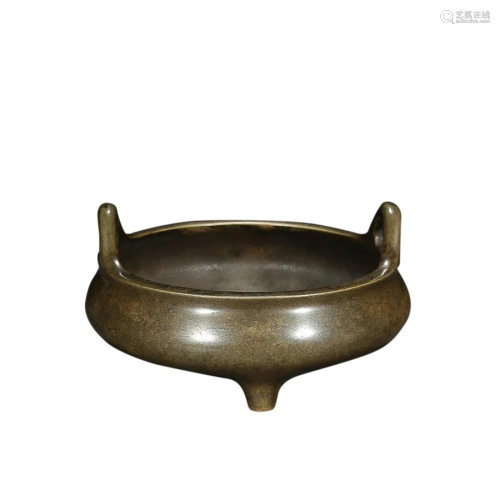 A BRONZE TRIPOD HANDLED CENSER