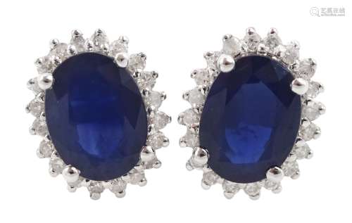 Pair of 14ct white gold oval sapphire and round brilliant cu...