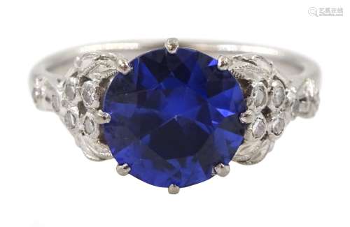 White gold round synthetic sapphire and diamond ring
