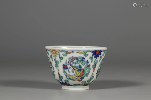 A DOUCAI 'BEASTS AND FLOWERS' PORCELAIN CUP