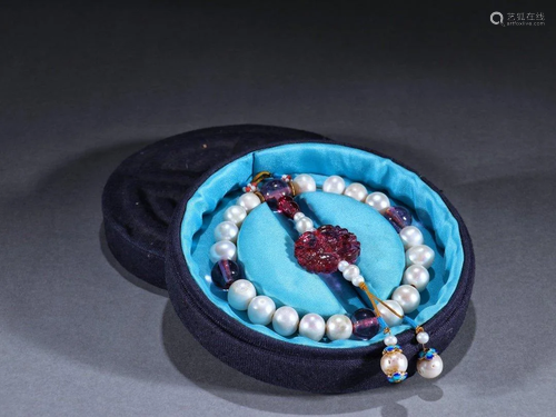 A PEARL BEADS PRAYER'S BRACELET