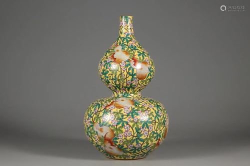 A JAUNE GROUND FAMILLE ROSE DOUBLE GOURD VASE