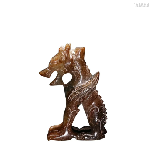 AN ANTIQUE JADE â€˜DRAGONâ€™ CARVING