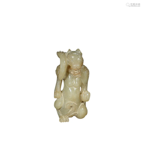 A HETIAN JADE 'BEAR' CARVING