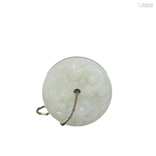 A HETIAN JADE â€˜CHILONGâ€™ BI DISC PENDANT