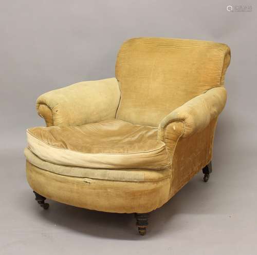 A VICTORIAN 'HOWARD' STYLE ARMCHAIR, with slightly scrolling...