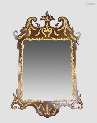 A GEORGE II GILT MAHOGANY WALL MIRROR. With a rectangular be...